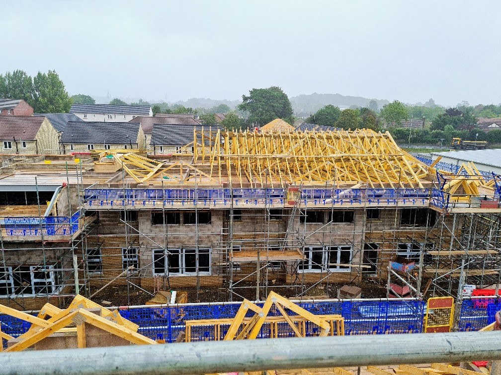 Roof going up and windows being installed